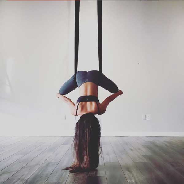 bound angle posture with woman in indoor studio